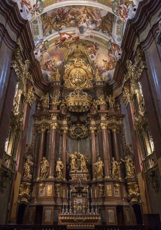 Gilded Baroque high altar and painted dome of Melk Abbey in Austria, a landmark of sacred music history
