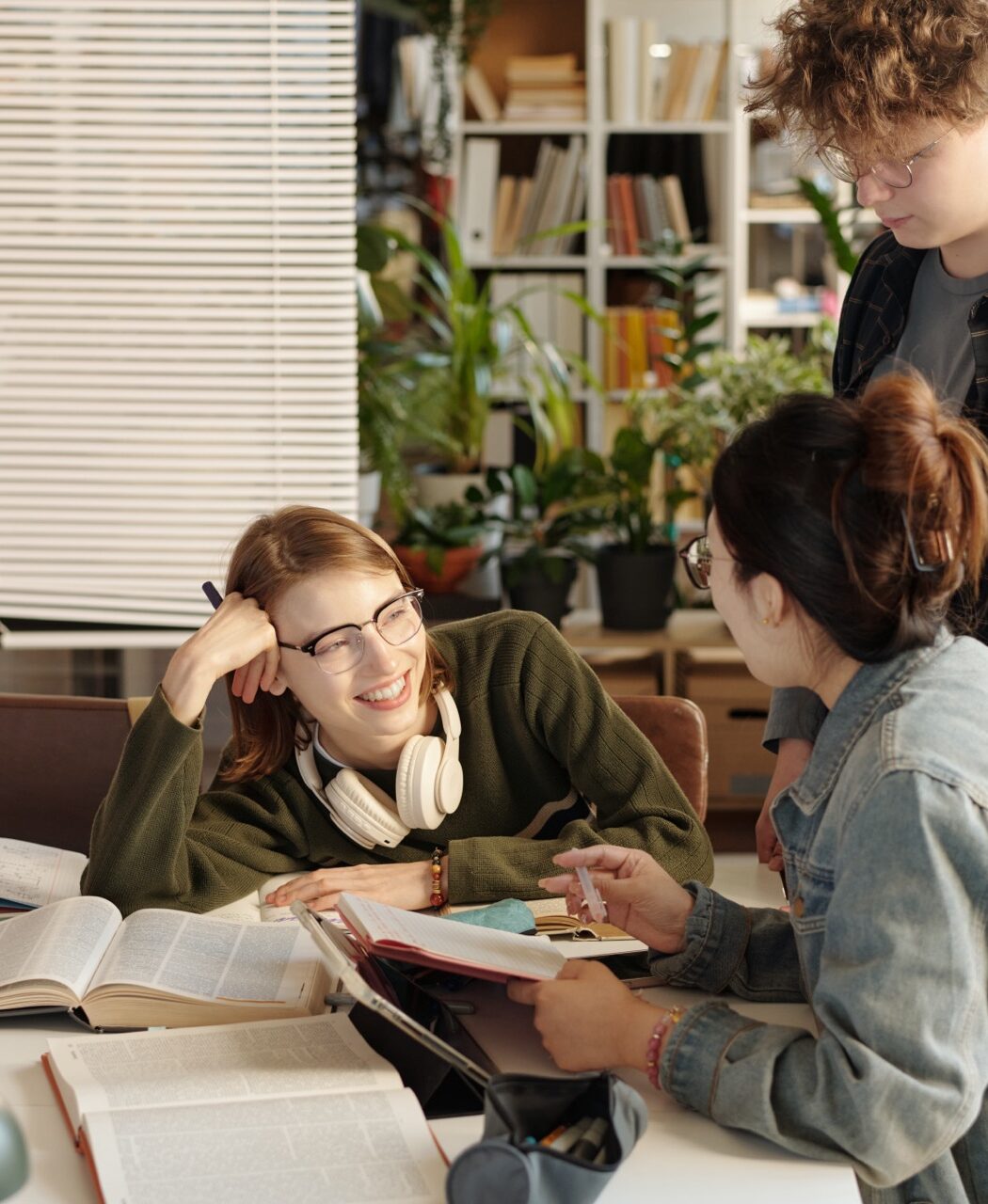 High school students reading together in a library